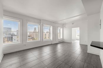 Unfurnished living room with windows